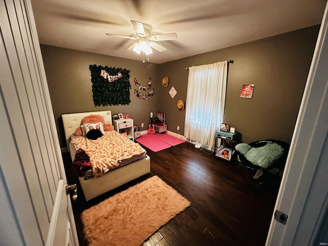 bedroom featuring hardwood / wood-style flooring and ceiling fan