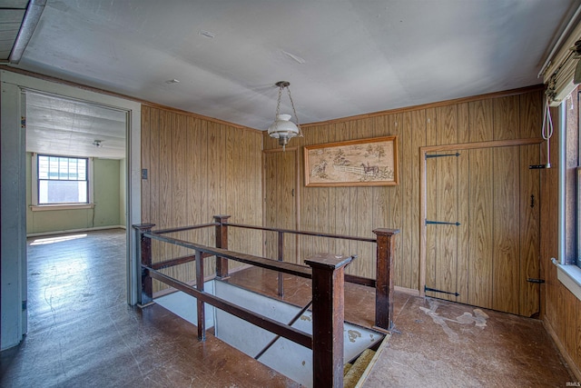 interior space featuring wooden walls