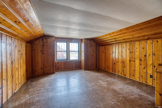 bonus room with wooden walls, wood ceiling, and lofted ceiling