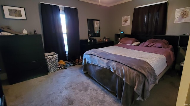 bedroom with light carpet and crown molding