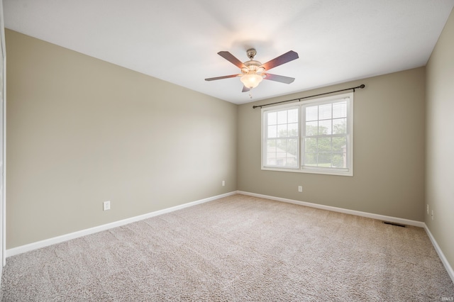 unfurnished room featuring carpet floors and ceiling fan