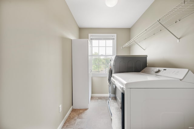 clothes washing area featuring washing machine and clothes dryer