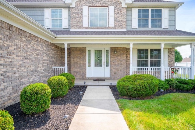 property entrance featuring covered porch