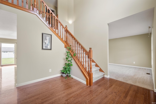 staircase featuring hardwood / wood-style flooring