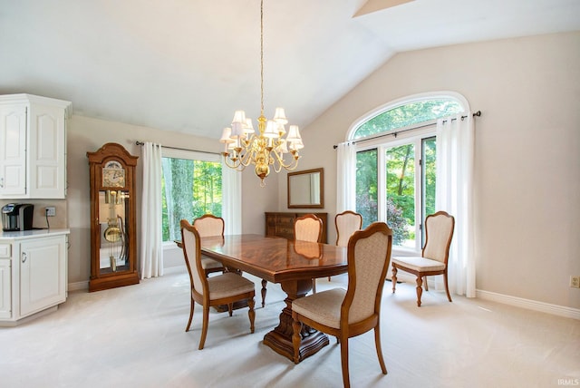 carpeted dining area featuring plenty of natural light, vaulted ceiling, and a notable chandelier