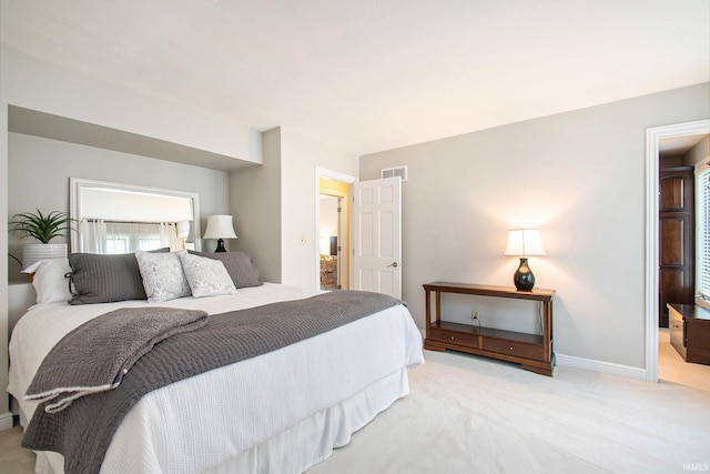 bedroom featuring light colored carpet