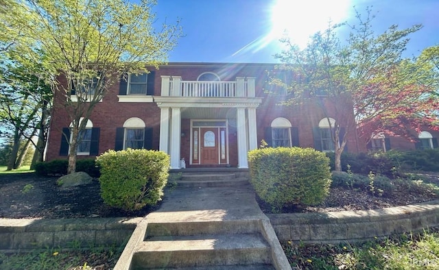 view of front facade with a balcony