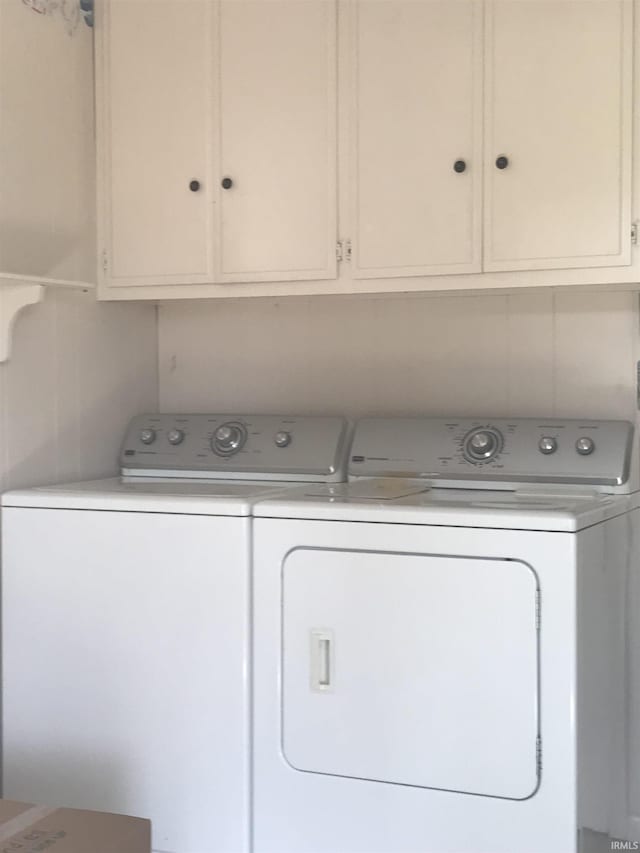 laundry room featuring separate washer and dryer