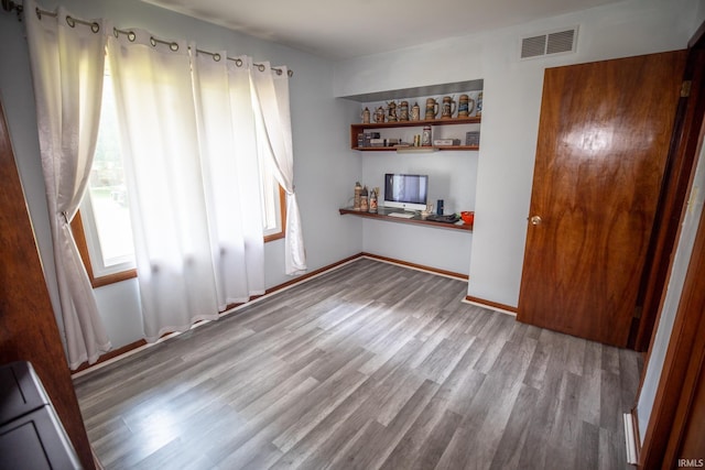 empty room featuring hardwood / wood-style flooring