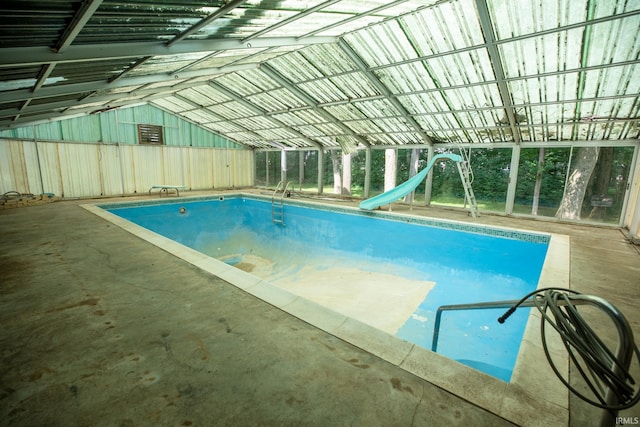 view of pool with a water slide