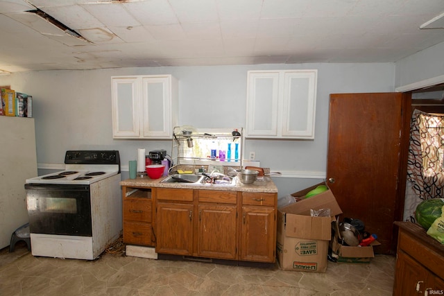 kitchen featuring electric range and sink