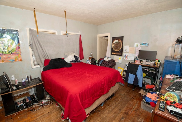 bedroom featuring dark hardwood / wood-style floors