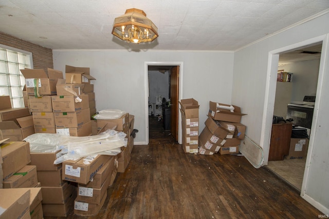 miscellaneous room with an inviting chandelier, dark hardwood / wood-style floors, and crown molding