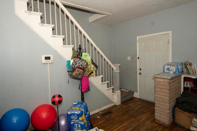 foyer entrance with dark hardwood / wood-style flooring