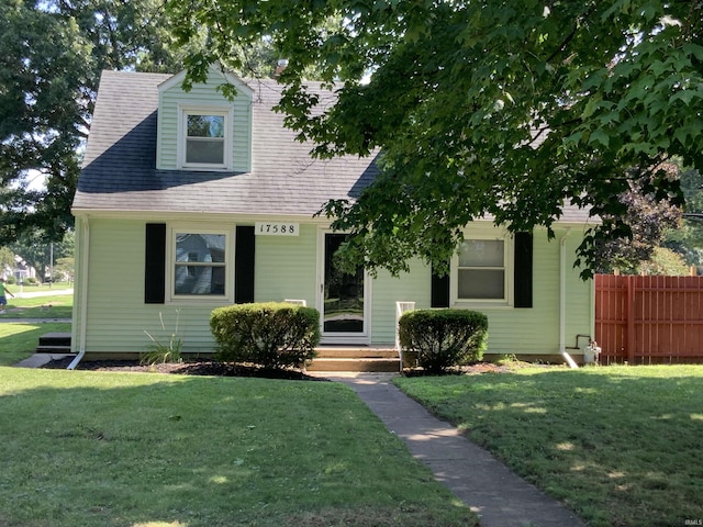 view of front of home with a front lawn