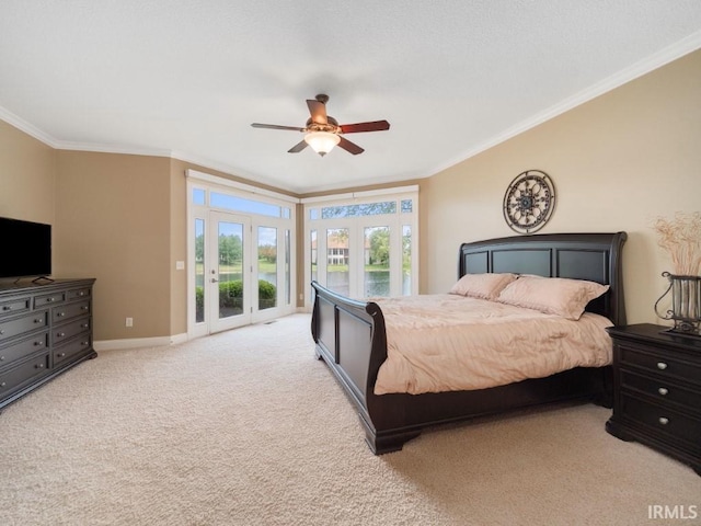 carpeted bedroom with crown molding, french doors, ceiling fan, and access to outside