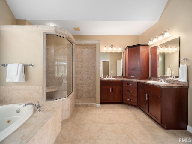 bathroom with plus walk in shower, tile patterned floors, and dual bowl vanity