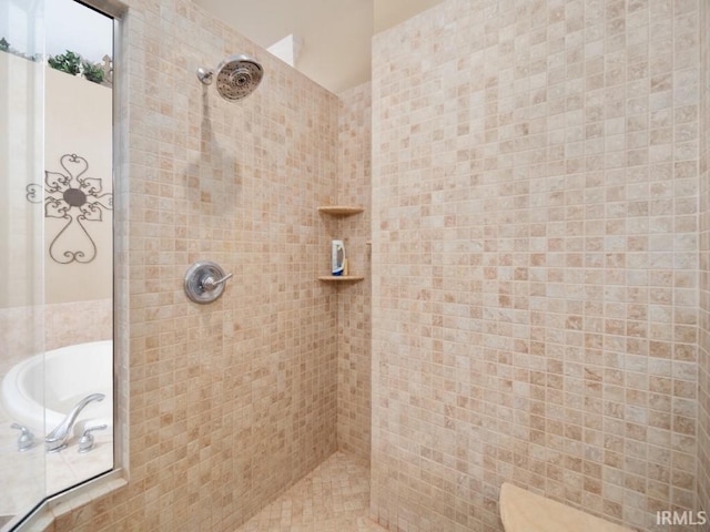 bathroom with a tile shower