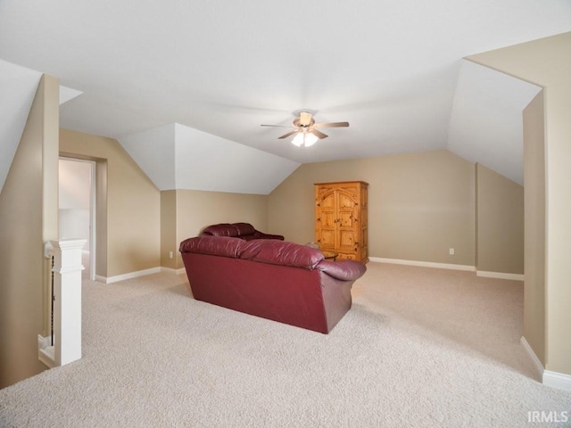 carpeted living room featuring ceiling fan and vaulted ceiling