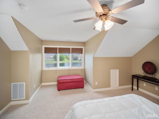 bedroom with carpet flooring, vaulted ceiling, and ceiling fan