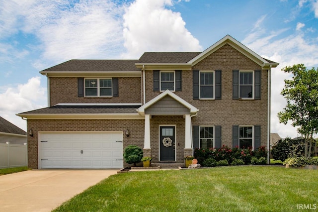 view of front facade featuring a garage and a front yard