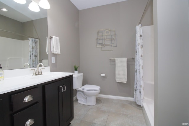 bathroom with vanity, toilet, and a shower with shower curtain