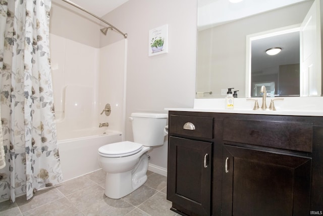 full bathroom with vanity, tile patterned floors, toilet, and shower / bath combo with shower curtain