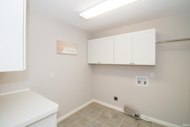 clothes washing area with cabinets, hookup for a washing machine, and electric dryer hookup