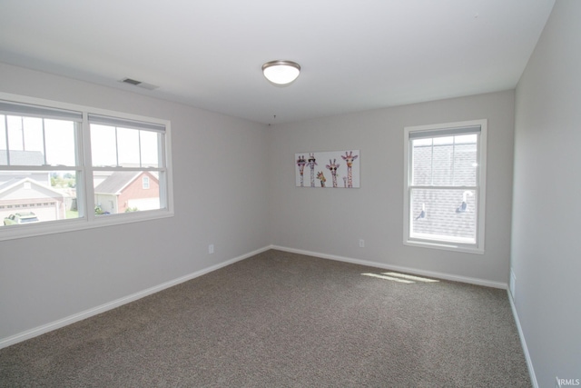 empty room featuring carpet floors