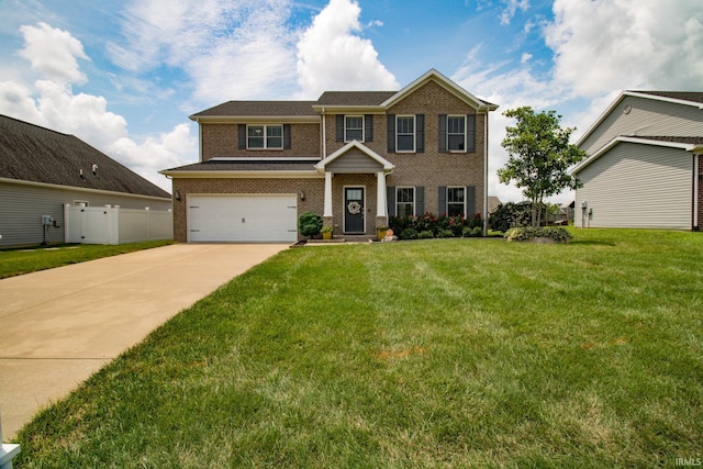 view of front of property with a garage and a front yard