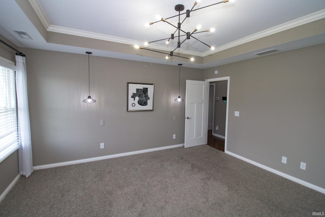 unfurnished bedroom with a raised ceiling, ornamental molding, and multiple windows