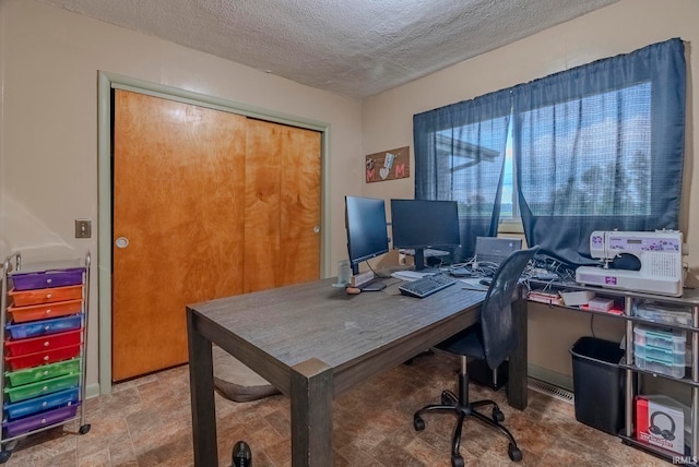 office with a textured ceiling