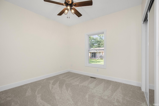 unfurnished bedroom featuring carpet floors and ceiling fan