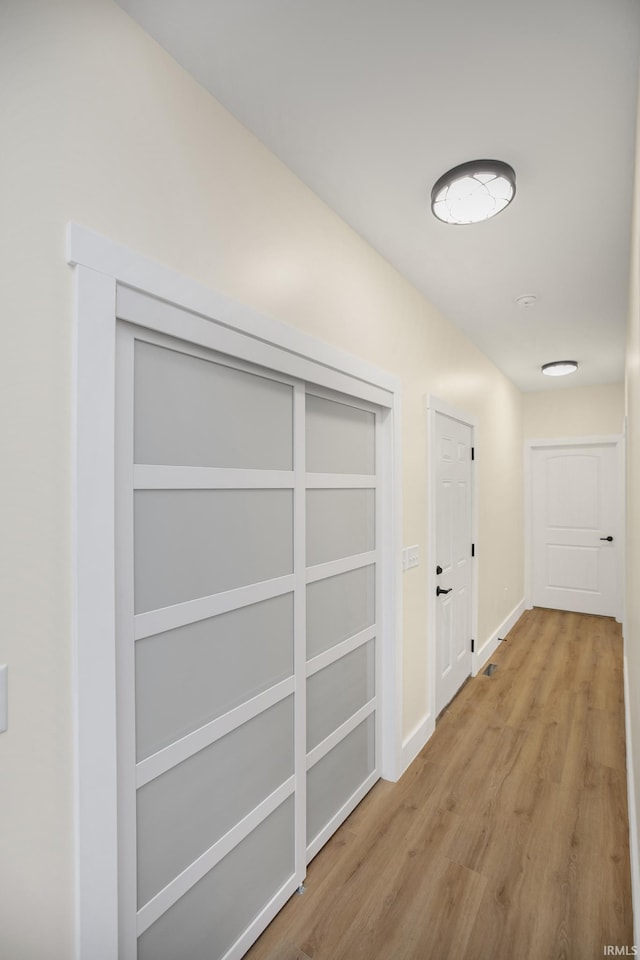 corridor featuring light hardwood / wood-style flooring