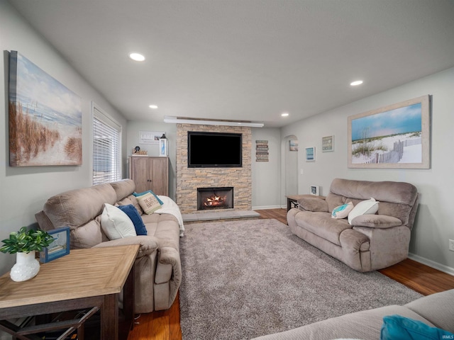 living room featuring hardwood / wood-style floors and a fireplace