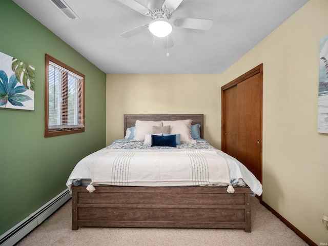 bedroom with light carpet, ceiling fan, and a baseboard radiator