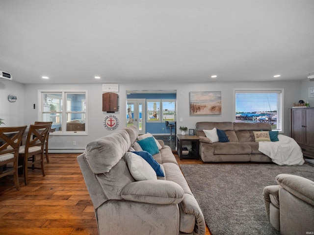 living room with dark hardwood / wood-style flooring