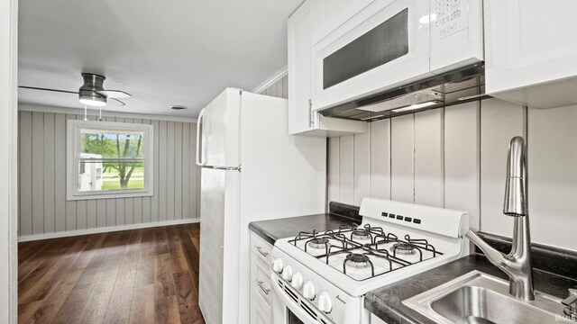 kitchen featuring white cabinetry, dark hardwood / wood-style floors, white appliances, and ceiling fan