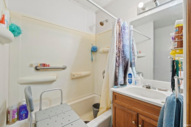 bathroom featuring shower / bath combo with shower curtain and vanity