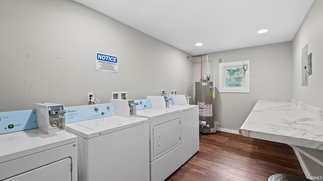 washroom featuring recessed lighting, dark wood-style flooring, baseboards, water heater, and washer and clothes dryer