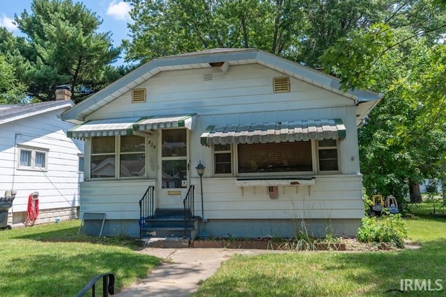 bungalow with a front lawn