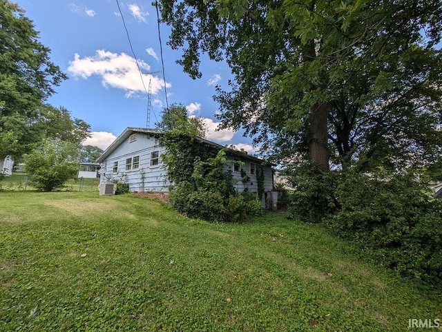 view of yard featuring central air condition unit