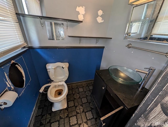 bathroom featuring vanity, toilet, and tile patterned floors