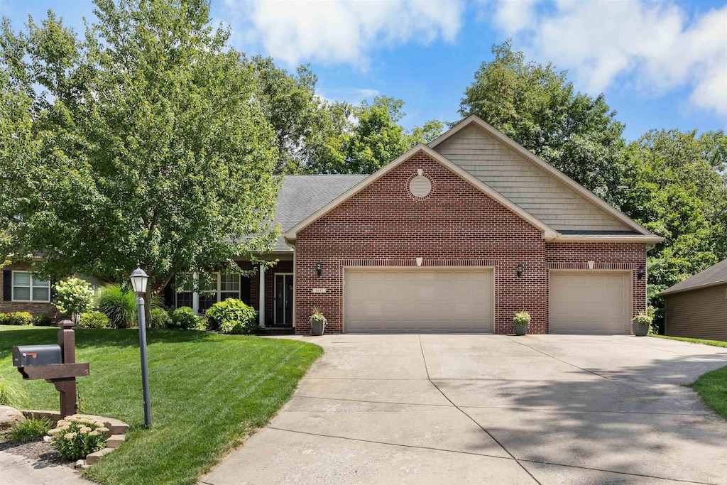 front of property with a garage and a front yard