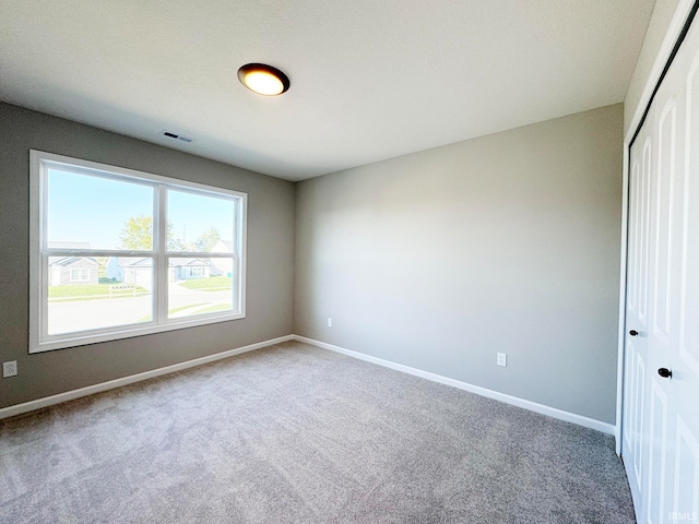 view of carpeted spare room