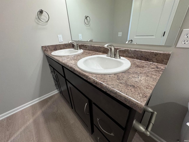 bathroom with vanity and hardwood / wood-style floors