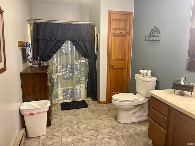 bathroom featuring baseboard heating, vanity, and toilet