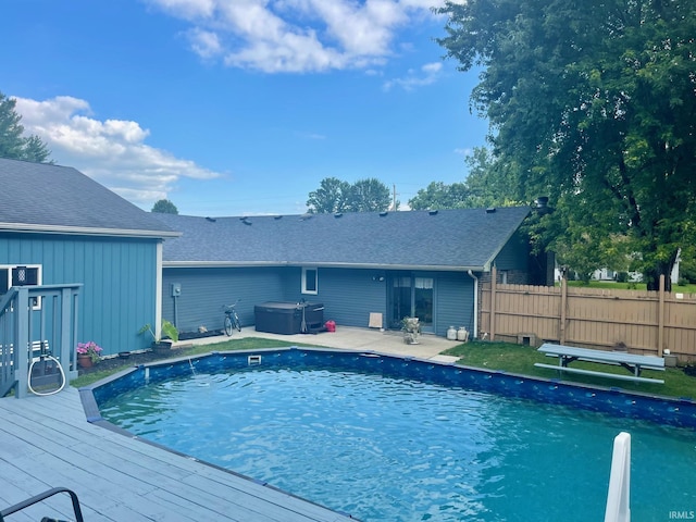 view of pool with a wooden deck