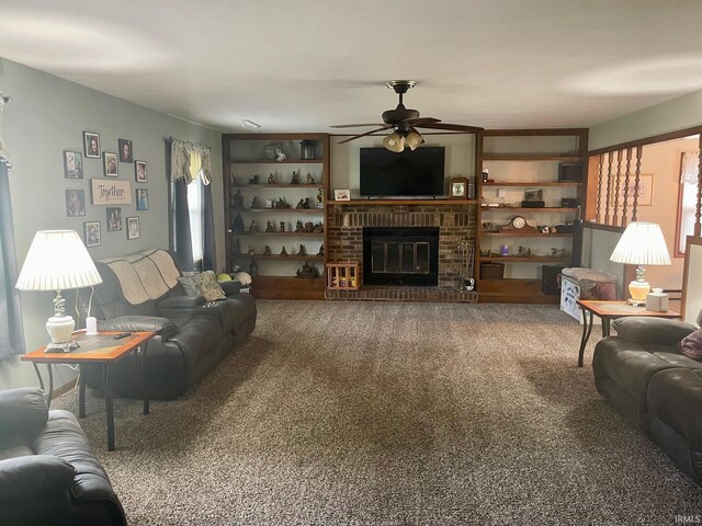 carpeted living room featuring a brick fireplace and ceiling fan