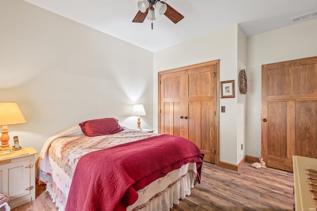 bedroom featuring hardwood / wood-style flooring and ceiling fan